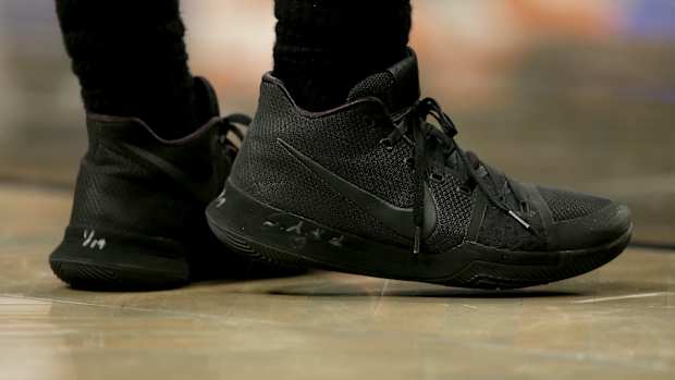 View of black Nike Kyrie shoes.